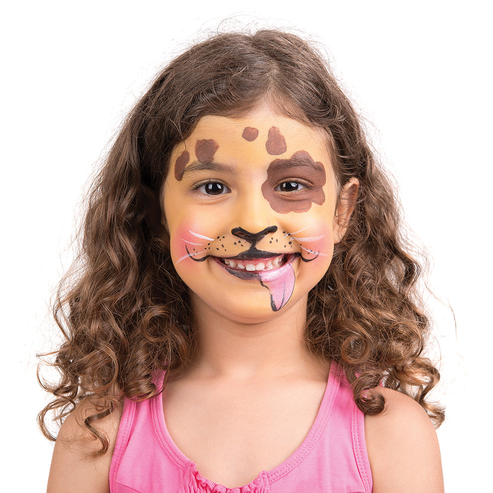 A young girl with curly brown hair and light skin wears Elseware Unplug’s eco-friendly face paint, styled as a playful puppy. The design includes brown spots, a black nose, whiskers, and a pink tongue sticking out on one side of her mouth. She is smiling and dressed in a pink sleeveless top. Elseware Unplug’s non-toxic, earth-friendly face paint is perfect for creative play, offering vibrant colors that are safe for kids and easy to wash off.