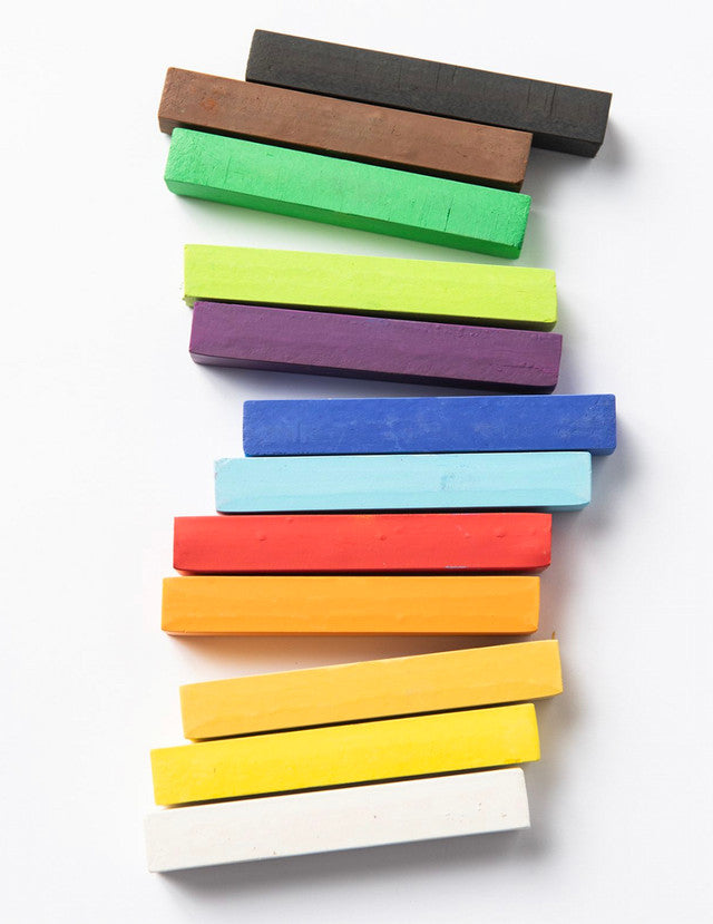 Brightly colored pastel sticks stacked in a diagonal pattern on white background – Elseware Unplug 12 pastel set