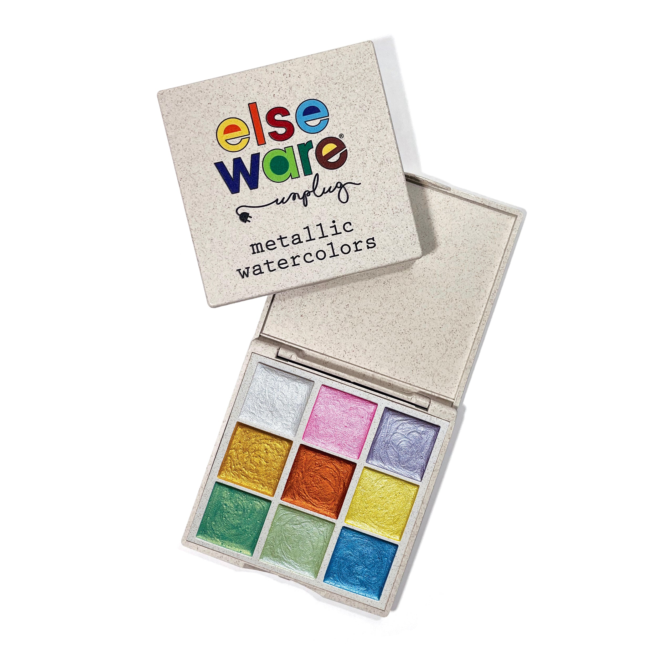 Elseware Unplug Metallic Watercolors palette with the lid slightly open, revealing nine shimmering pastel shades. Packaged in a sustainable wheat straw bioplastic case, these hand-poured watercolors offer a radiant, eco-friendly way to add sparkle to any artistic creation.