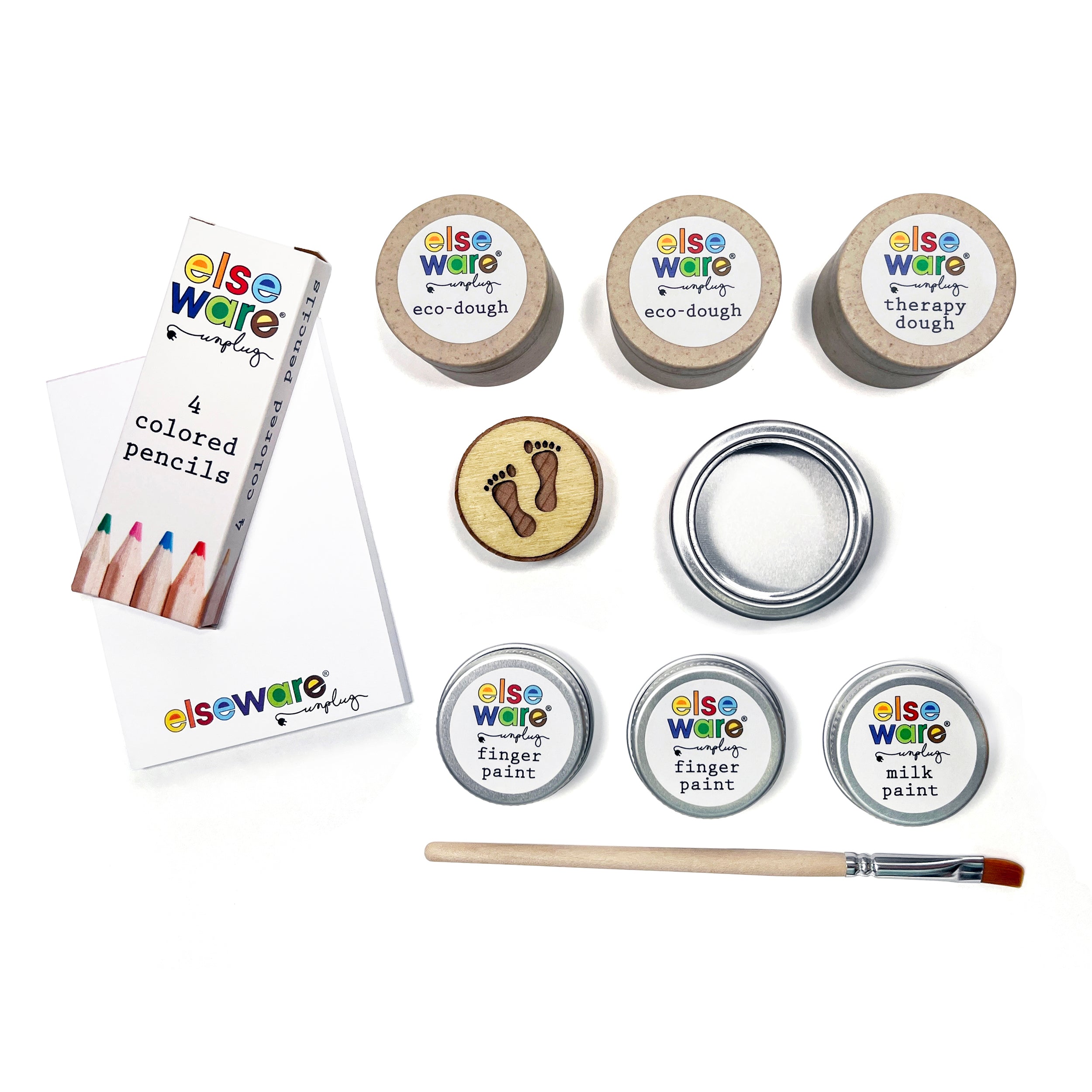Elseware Unplug Sample Kit contents displayed on a white background, including colored pencils, a notepad, eco-dough, therapy dough, finger paints, milk paint, a paintbrush, an animal tracker, and a metal tin. A curated collection of earth-friendly, safe, and nontoxic products designed to inspire creativity and relaxation.