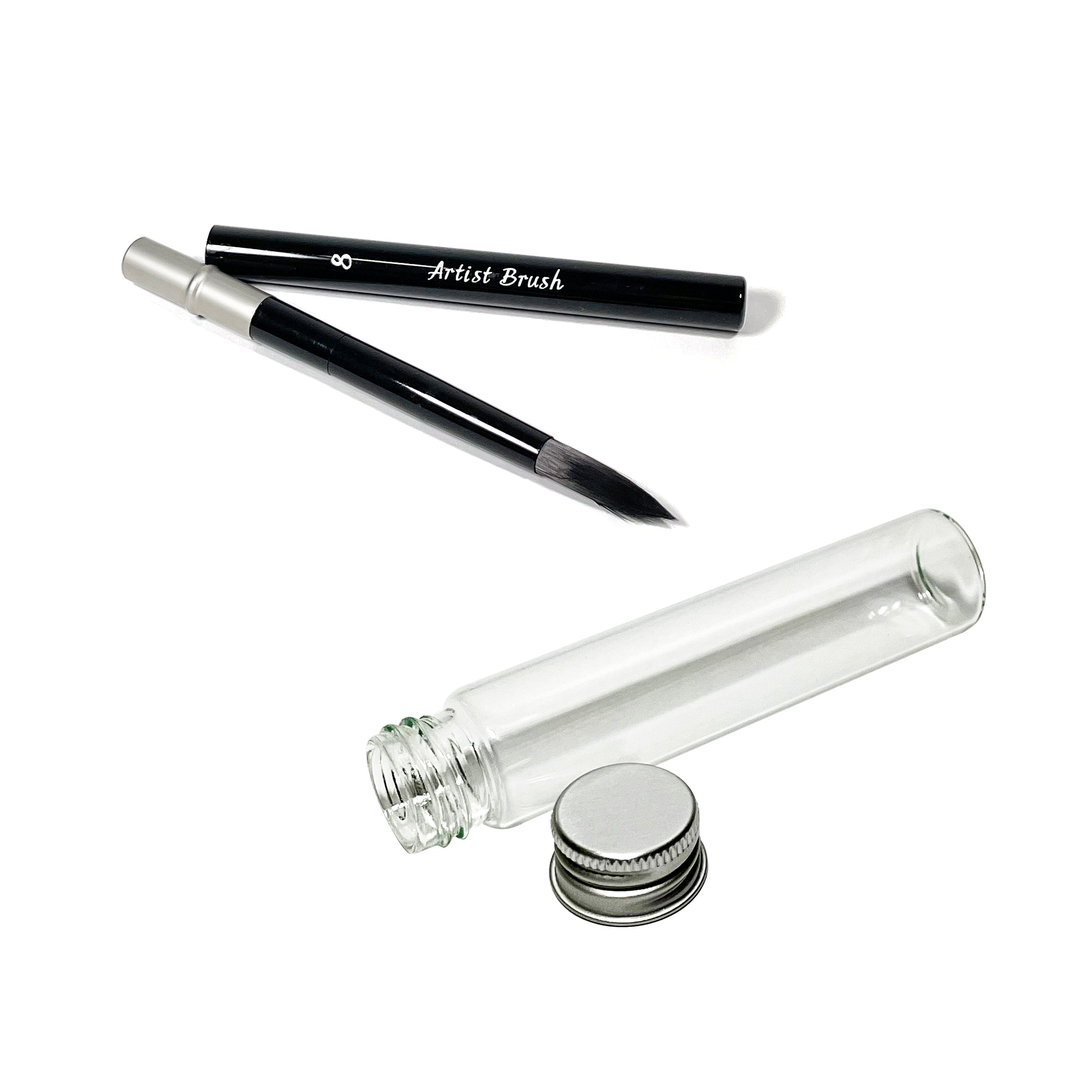 A sleek black artist brush and a small glass water vial with a metal screw-on lid, both included in the Elseware Unplug Watercolors to Go Kit, designed for painting on the go.
