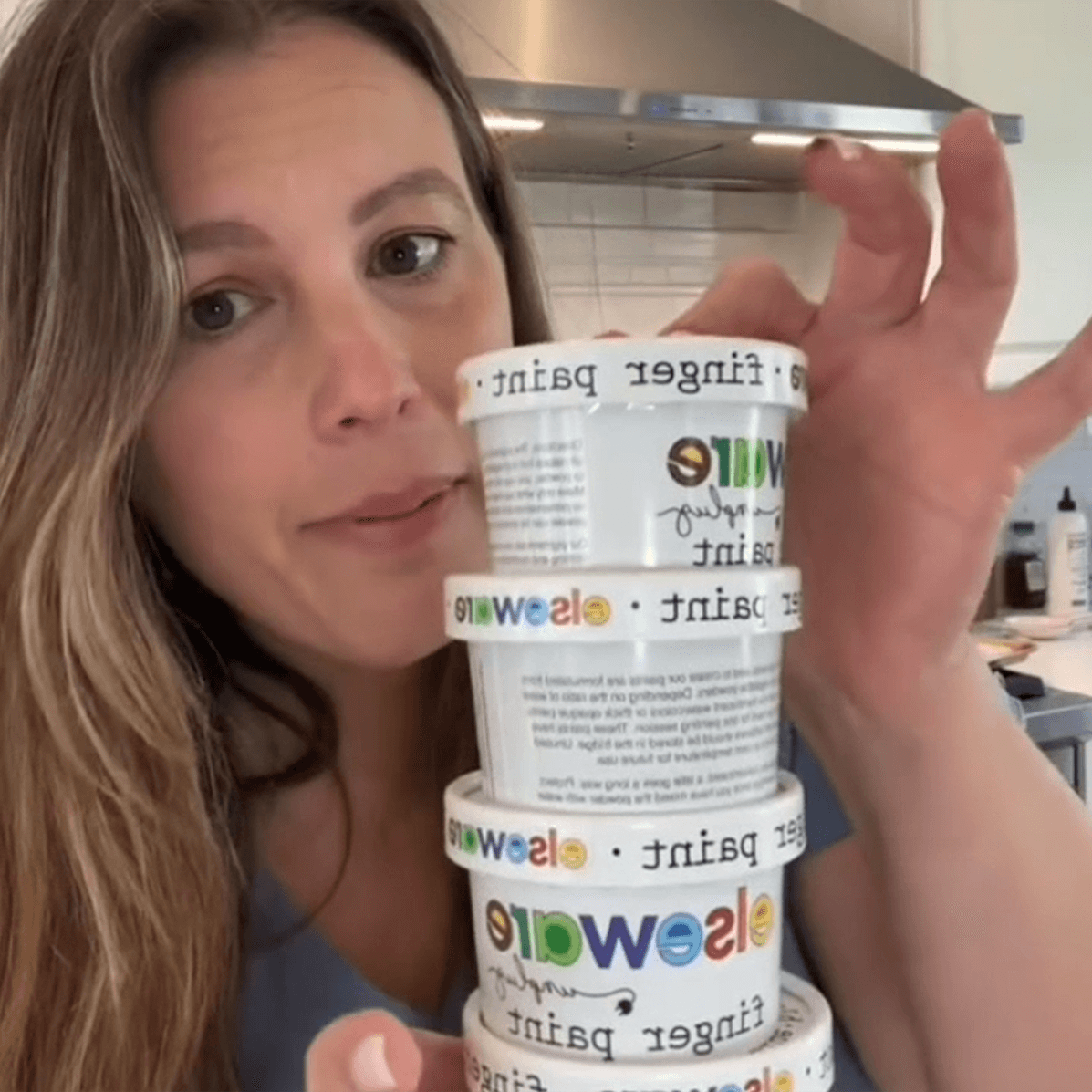 Woman in kitchen talks about Elseware Unplug’s non-toxic finger paints, made in Raleigh, NC