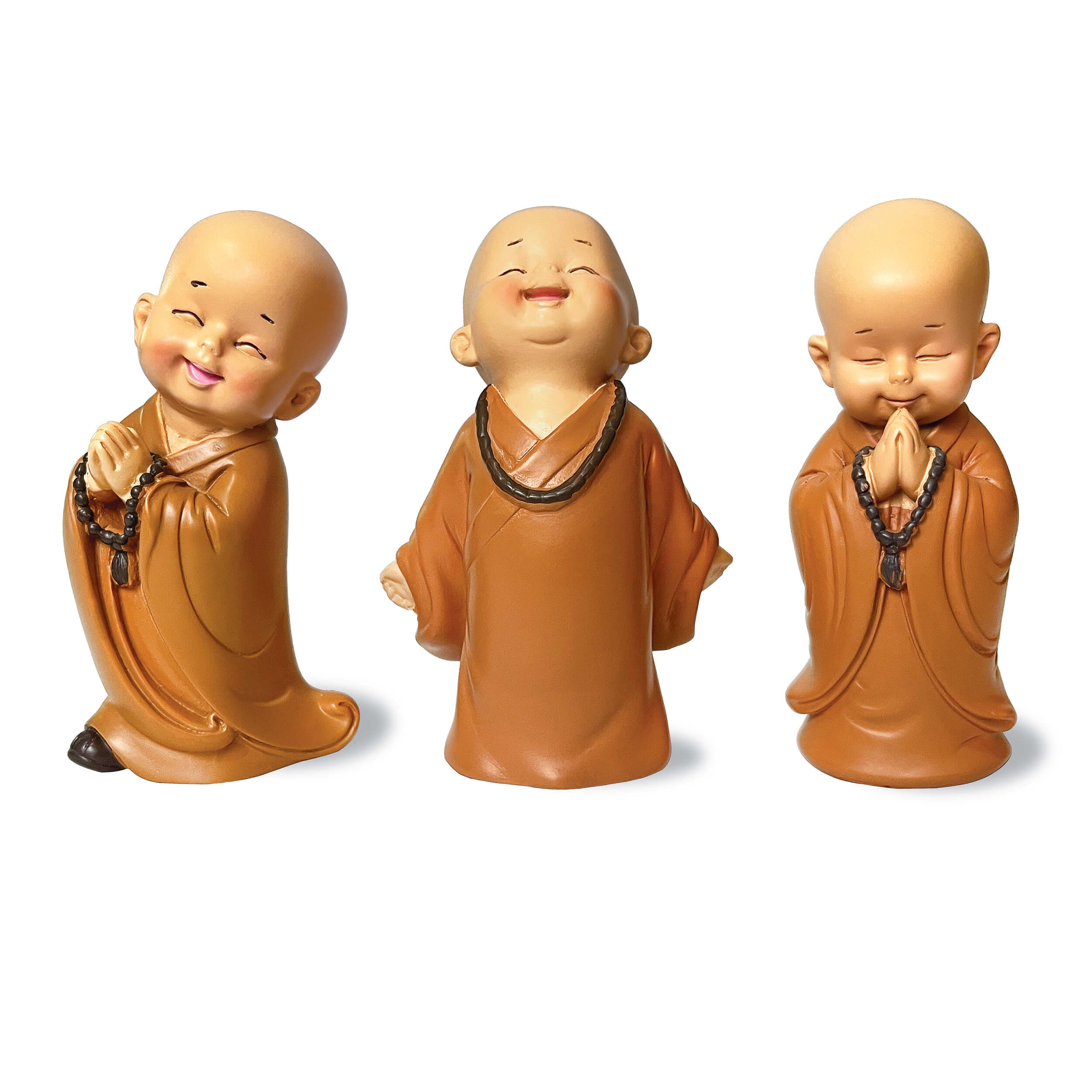 Three ceramic monk figurines in various poses on a white background