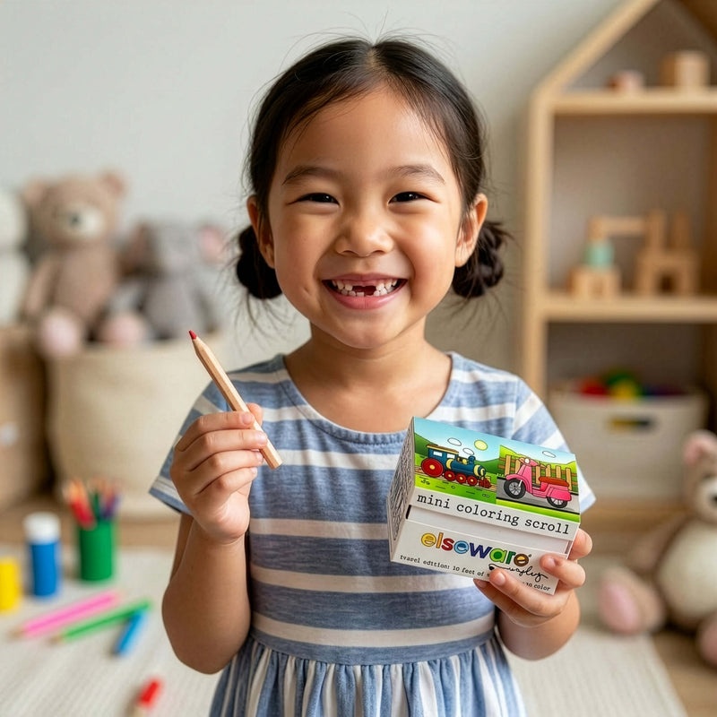 Child holding a coloring book and pencil in a playroom setting