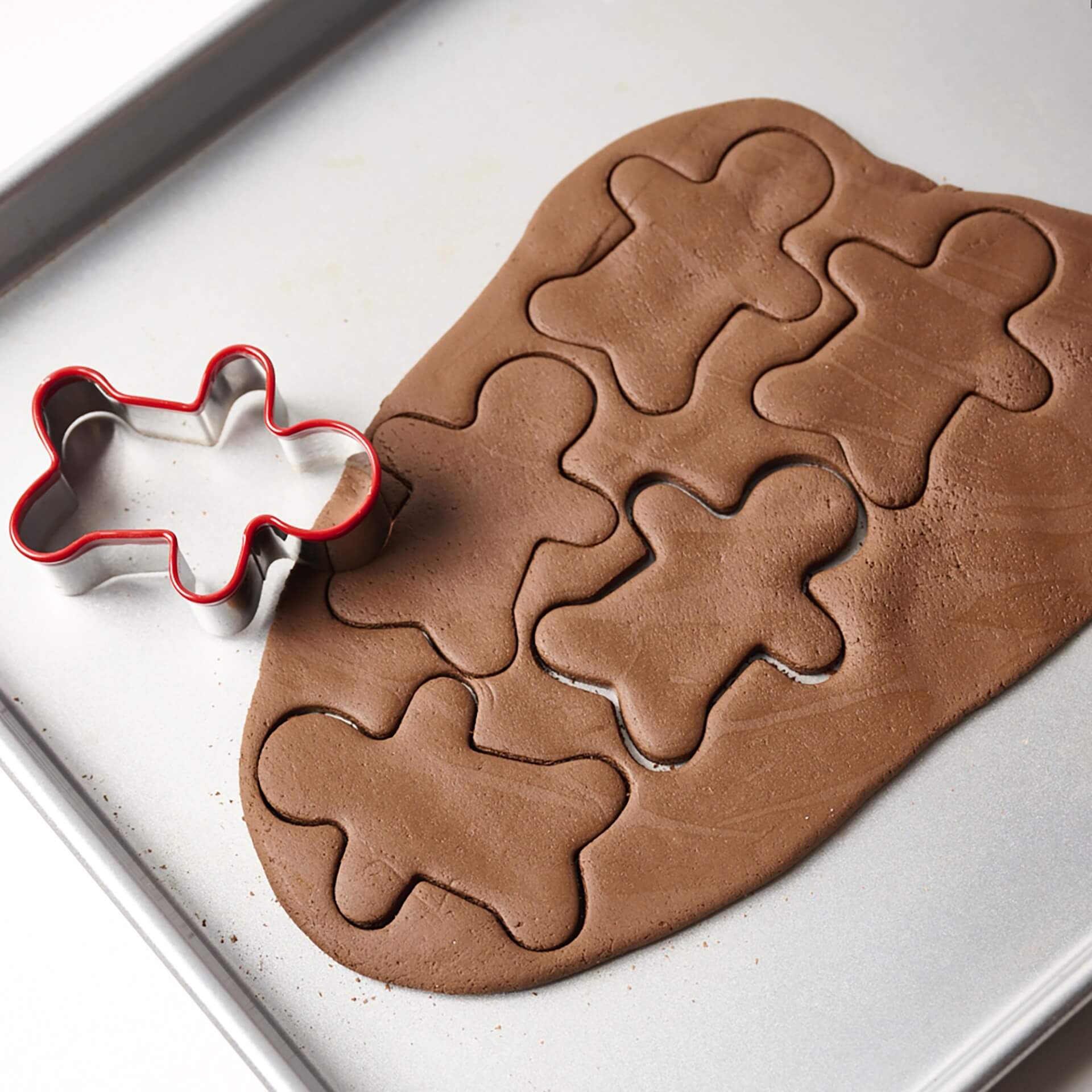 elseware unplug gingerbread cookie cutter on a grey pan showing the cutout